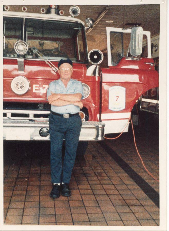 E. Francis Jones — founding secretary of Arundel VFD, 1954 — beside the engine.