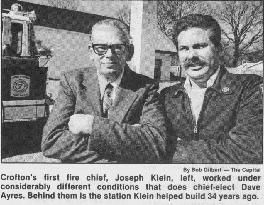 First fire chief Joseph Klein with chief-elect Dave Ayres — behind them, the station Klein helped build 34 years earlier.