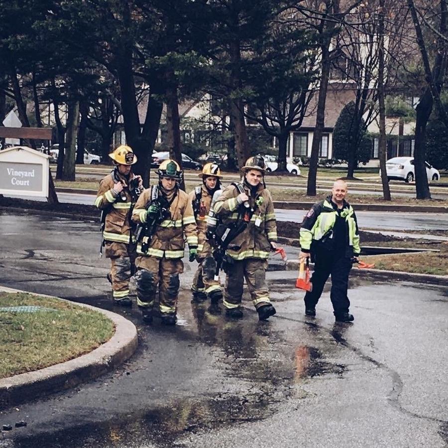 AVFD firefighters in turnout gear walking back from a call